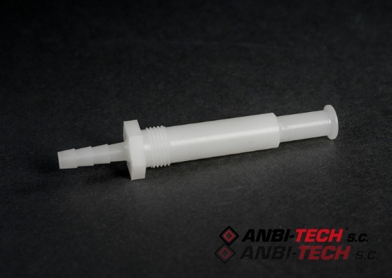 A white plastic connector with a hose barb, external thread and flange, lying on a dark background.