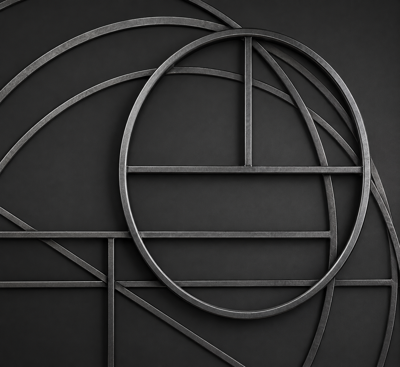 Metal rings and rectangular frames in various sizes with a matt surface, arranged against a dark background.